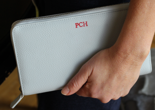 me holding pouch.png